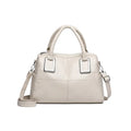 Simple large capacity women's shoulder bag in a horizontal square shape with internal phone and document pockets.
