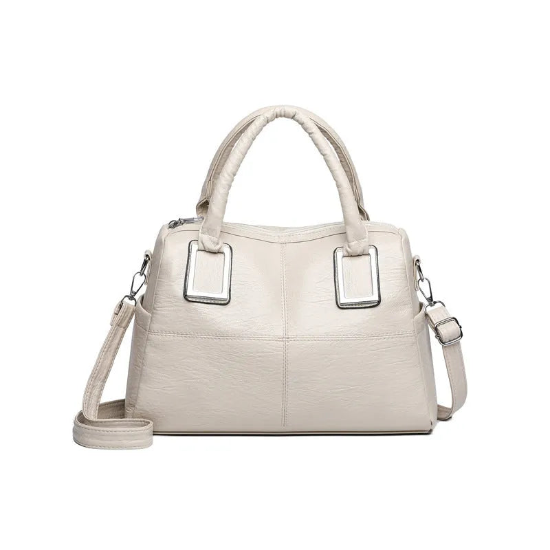 Simple large capacity women's shoulder bag in a horizontal square shape with internal phone and document pockets.