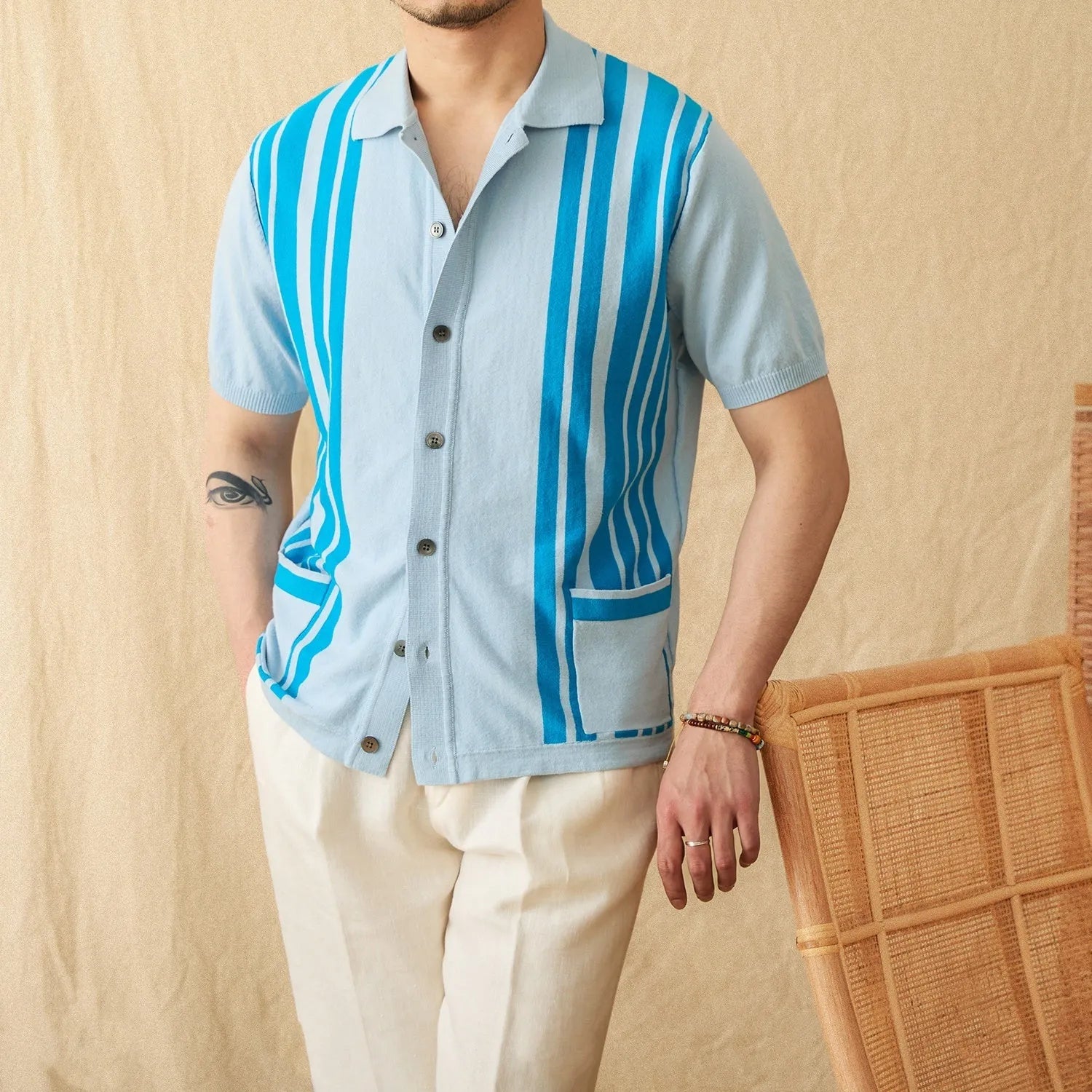 Men's striped cotton blend cardigan polo shirt with short sleeves and a lapel collar.