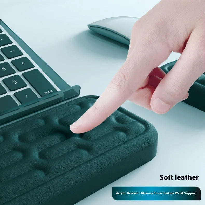 Memory foam keyboard and mouse pad with wrist rest in various colours on a desk