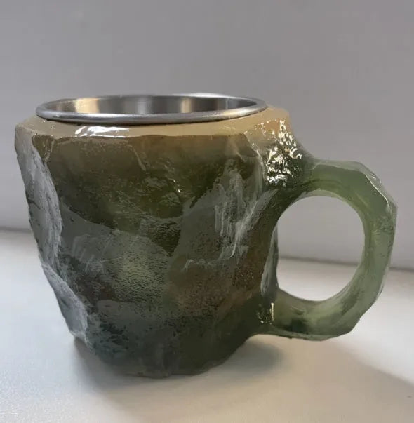 A solid purple resin coffee mug with a handle on a white background.