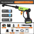 Green wireless high pressure water gun with multiple nozzle attachments on a table
