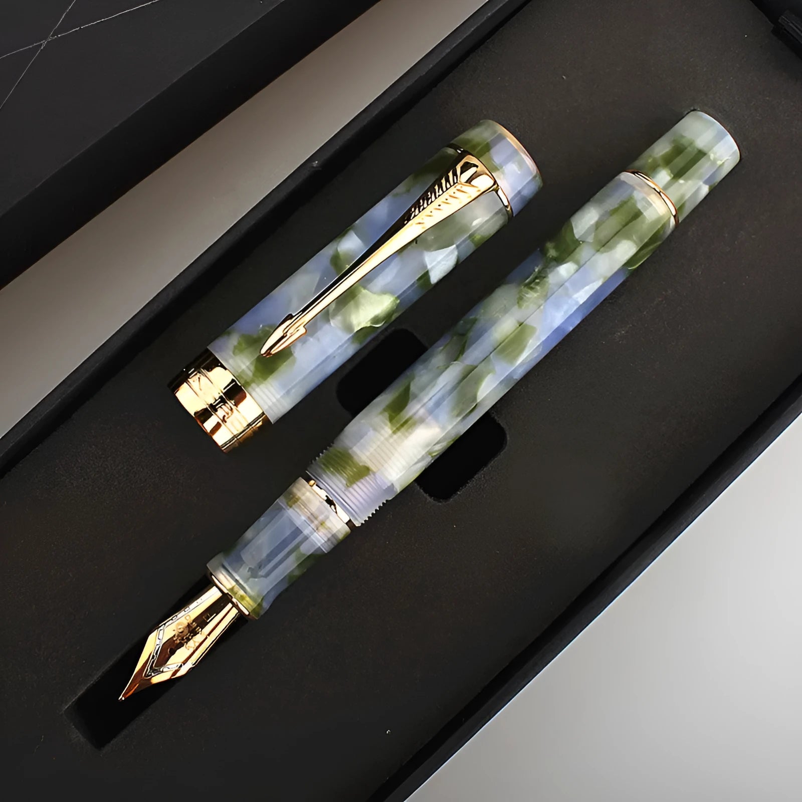Deep bath green metal ballpoint pen with cap and clip, shown on a neutral background