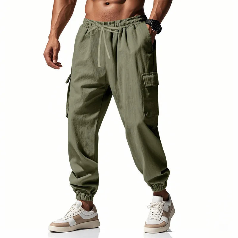 Men's loose-fit linen trousers with ankle ties and multiple pockets in Army Green.