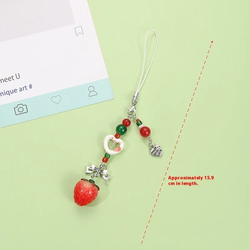 Fruit-shaped mobile phone bag pendant keychain in plastic resin with apple and strawberry design, half-handmade finish, multiple colour options
