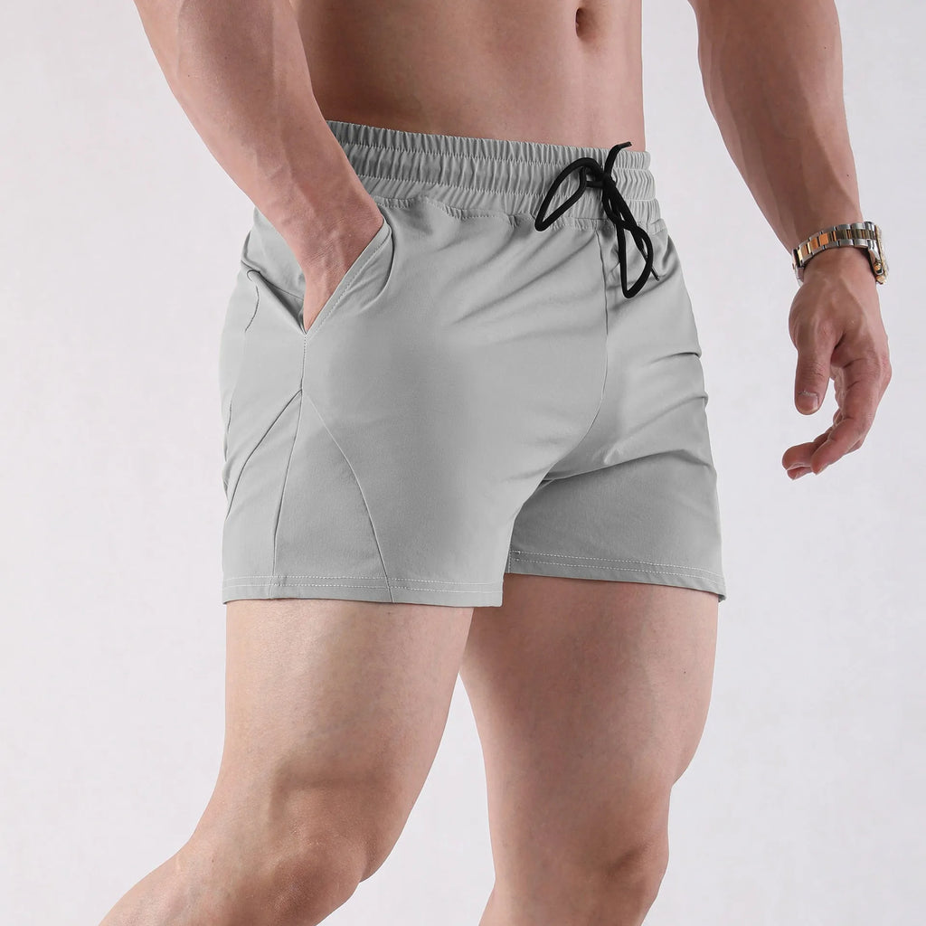 Men's thin polyester basketball shorts in grey colour with elastic waistband for summer sports