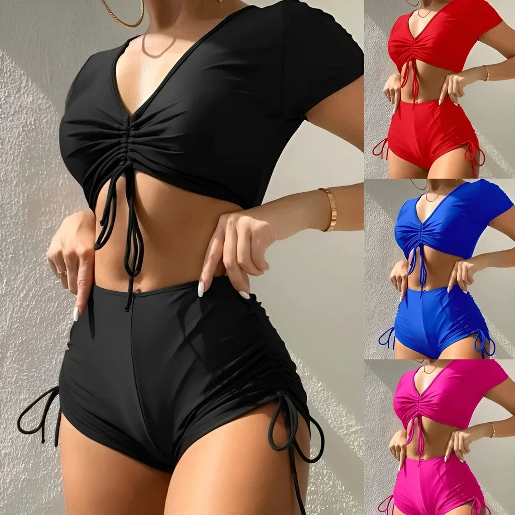 Dark green ladies lace-up bow swimsuit top with matching shorts on a mannequin