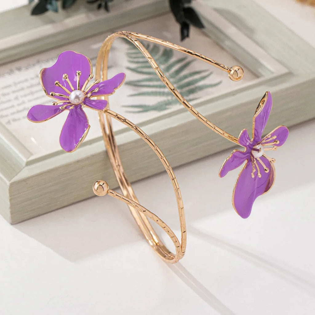 Alloy hollow armband bracelet with decorative pattern in pink or purple colour
