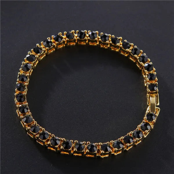 Men's silver geometric link bracelet with rows of clear rhinestones and a dangling tennis racket charm.