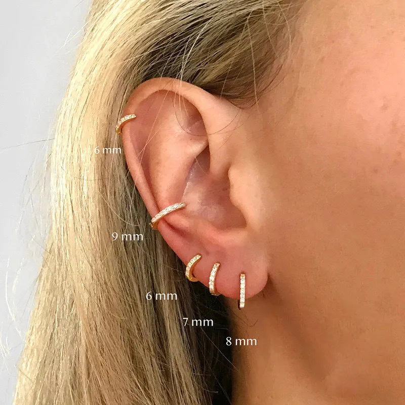 Round zircon perforated stud earrings in gold, rose gold, or silver colour with geometric design