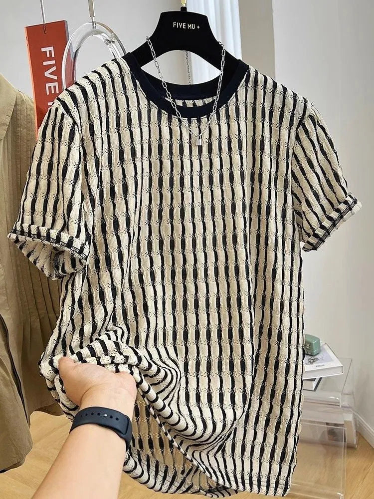 Men's black striped casual shirt with loose fit and short sleeves on hanger