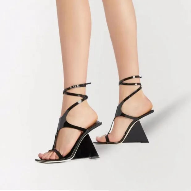 Women's black high heel sandals with 9.5cm heel and button fastening on a square toe.