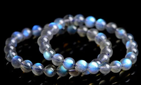 Natural cream body blue moonlight crystal bracelet on a plain background showing its size and style.