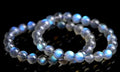 Natural cream body blue moonlight crystal bracelet on a plain background showing its size and style.