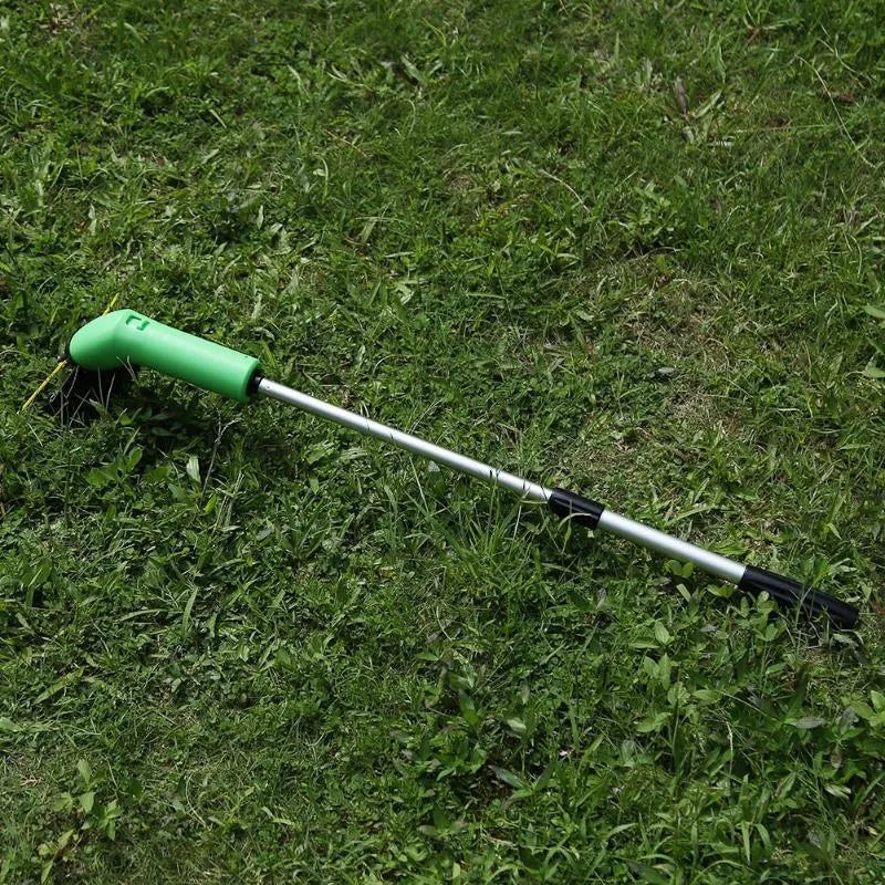 Cordless handheld zip trimmer with extension pole and debris shield on grass