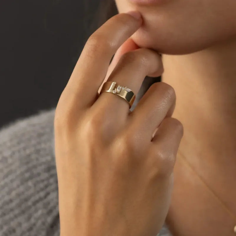 Gold electroplated women's ring with a central zircon stone, shown in size options 6 to 10.