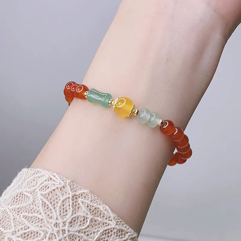 Red agate bracelet for women with Chinese style dragon motif, handmade from natural stone