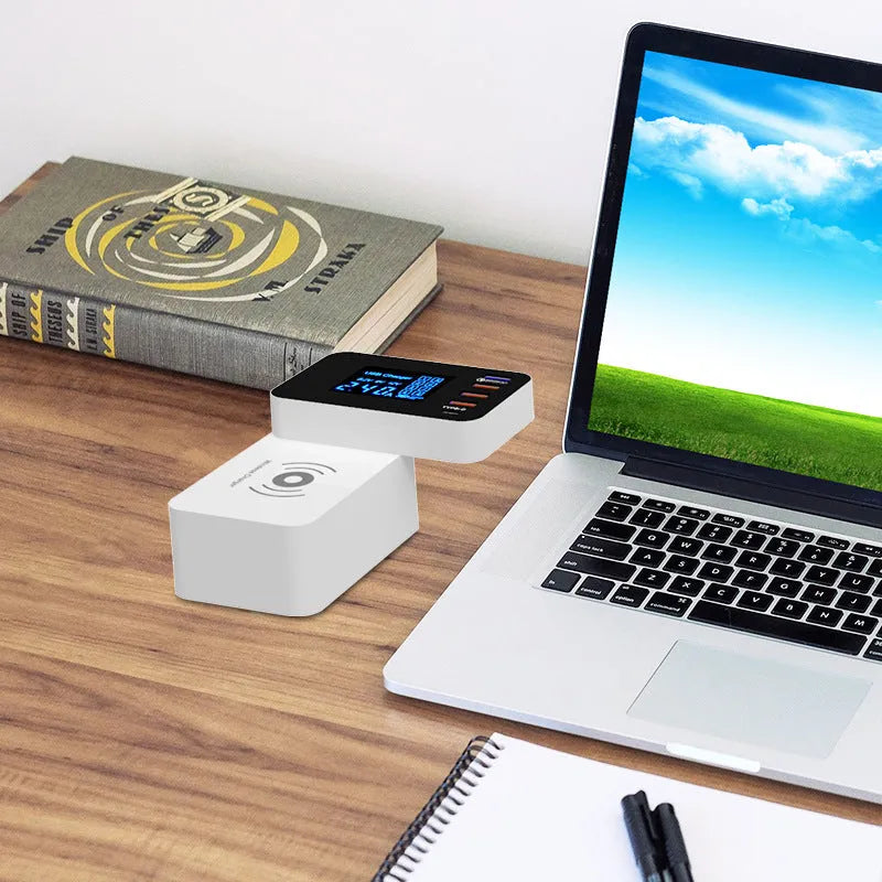White 10W wireless charger with multi-USB ports and indicator light on a desk