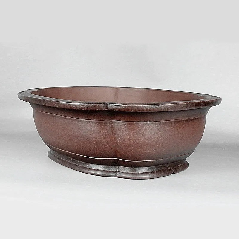 Handmade antique crabapple shaped purple clay flowerpot measuring 74x61x23cm.