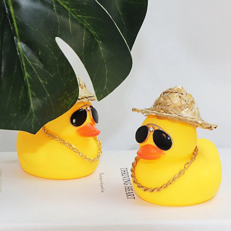 Yellow cartoon duck with straw hat car dashboard ornament on adhesive base with sunglasses necklace