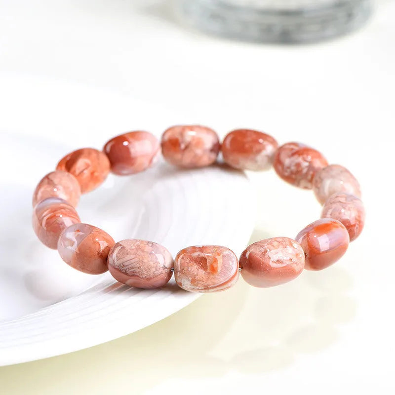 Natural cherry agate bracelet with 10x14mm barrel beads and Ruyi decorative elements
