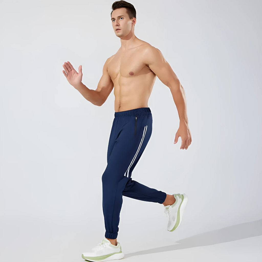 Men's black running trousers with mid waist design and polyester fabric for exercise