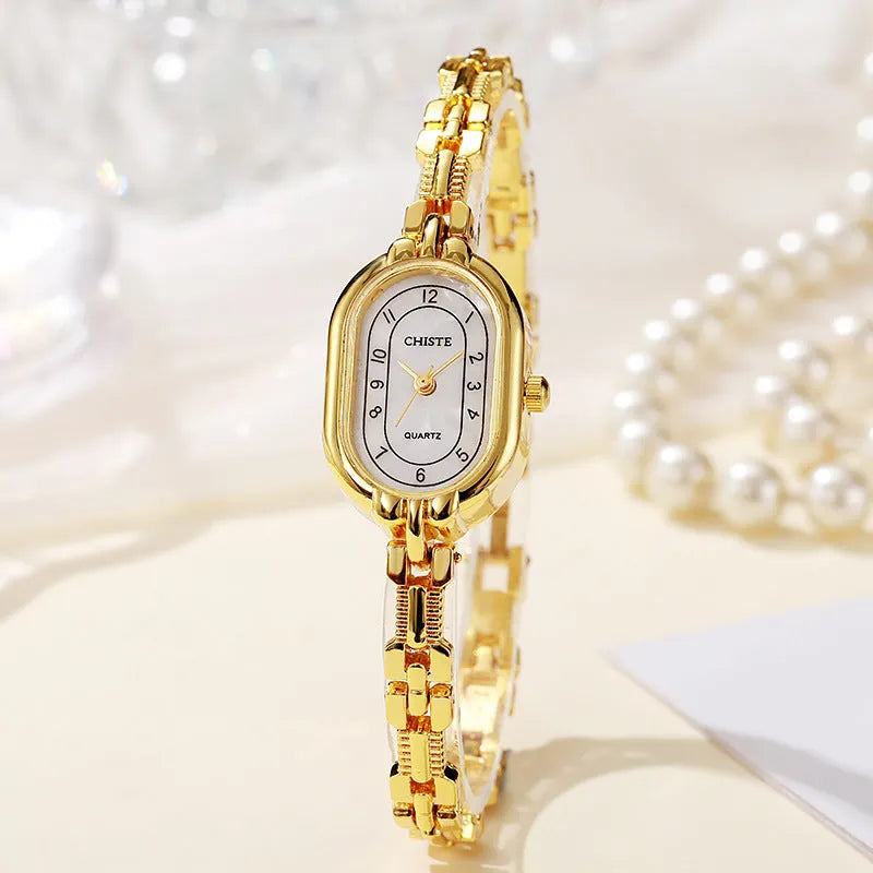 Retro oval women's quartz bracelet watch with metal strap and gold-tone dial