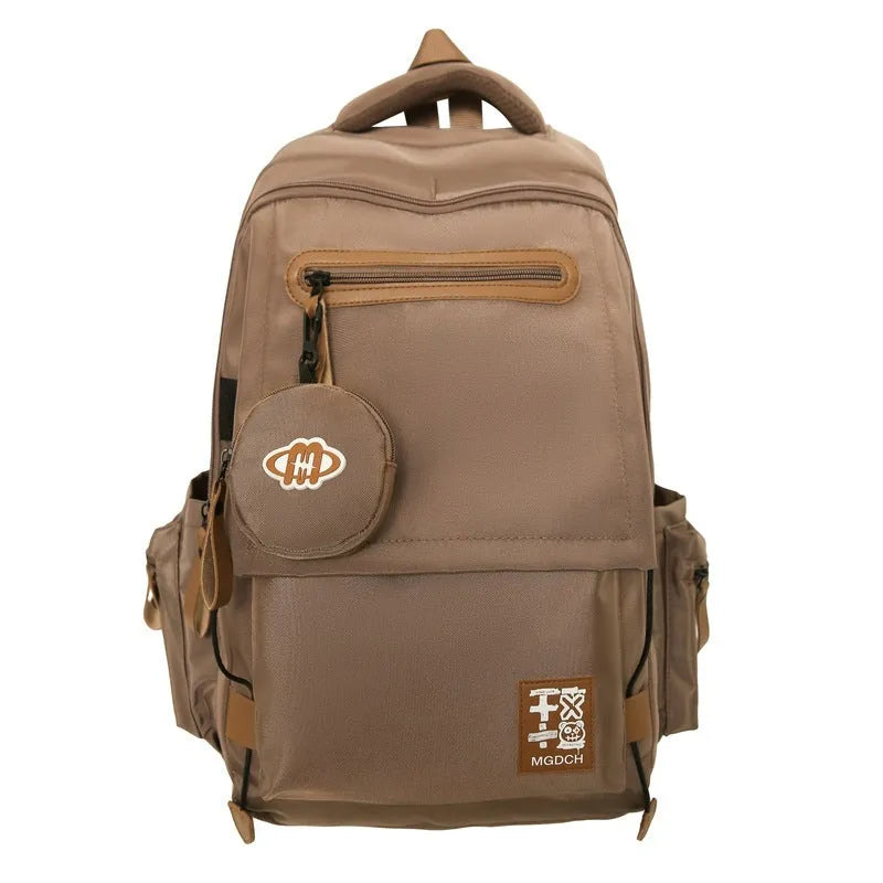 New large-capacity nylon school backpack for middle school students in solid colour with curved shoulder strap