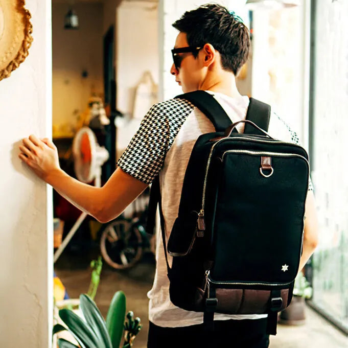 Men's modern Oxford cloth backpack in army green colour, showing its large 30x16x46cm capacity and Korean-style design.