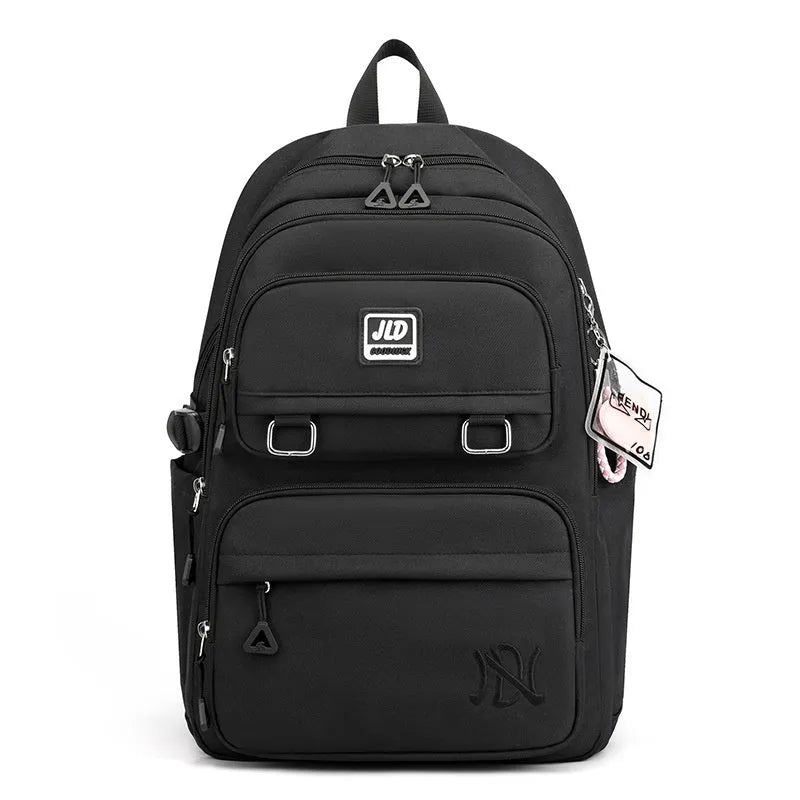 Girls' large nylon school backpack in a choice of colours and patterns including geometric graffiti and solid purple.