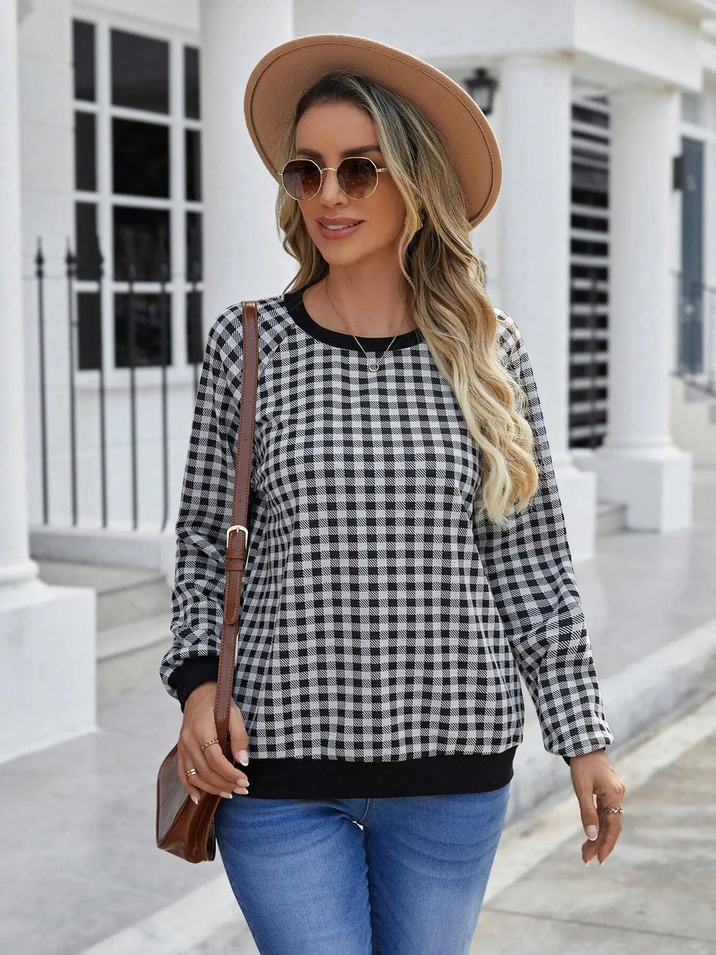 Black polyester pullover sweater with printed plaid pattern and long sleeves