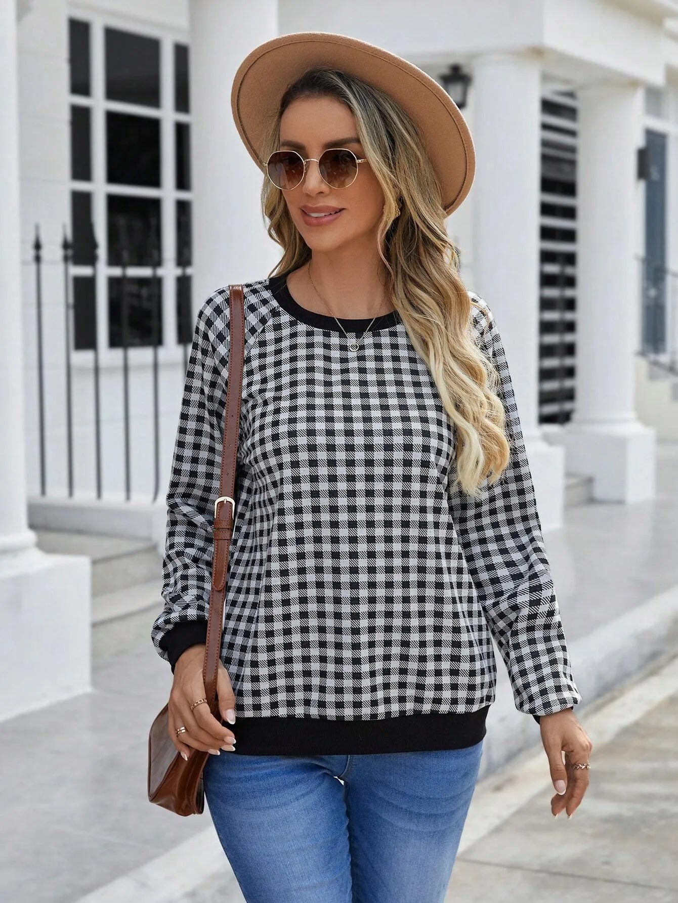 Black polyester pullover sweater with printed plaid pattern and long sleeves