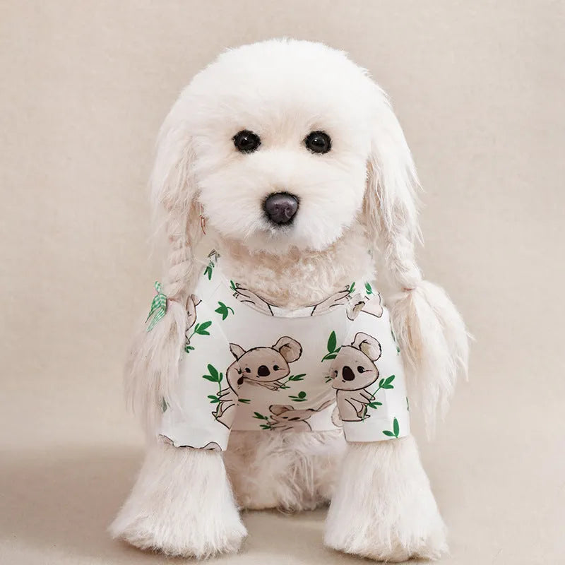 Small dog wearing printed polyester T-shirt with size chart showing bust and length measurements