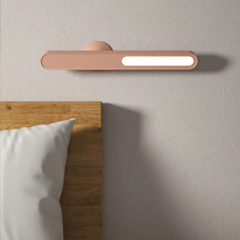 Geometric creative desk lamp with magnetic base shown in white on a desk.