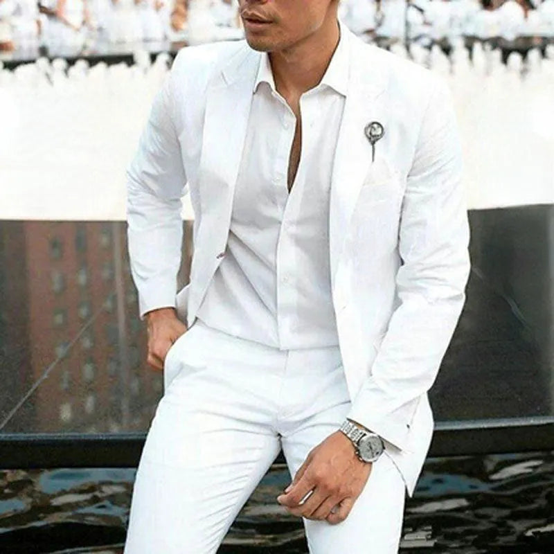 Men's white slim fit two-piece wedding suit jacket and trousers on a hanger.