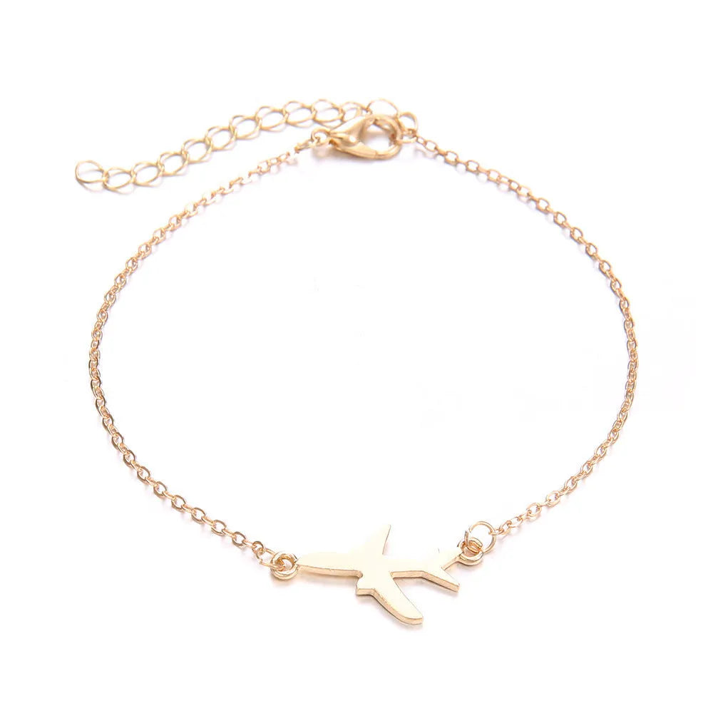 Set of three women's bohemian bracelets with heart-shaped aircraft map charms.