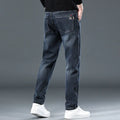 Slim straight casual trousers in black with micro-elastic fabric and mid-waist design