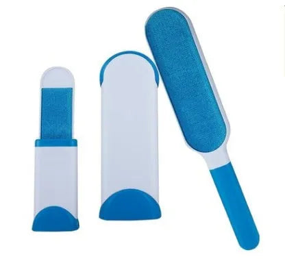 Blue self-cleaning pet hair removal brush for sofas on a grey fabric couch.