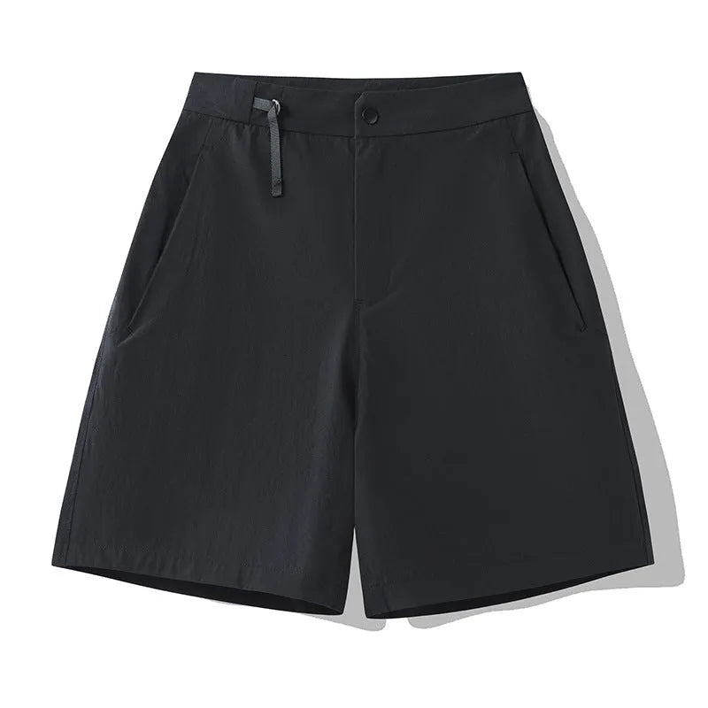 Men's solid colour quick-dry sports shorts with elastic waistband shown in Army Green