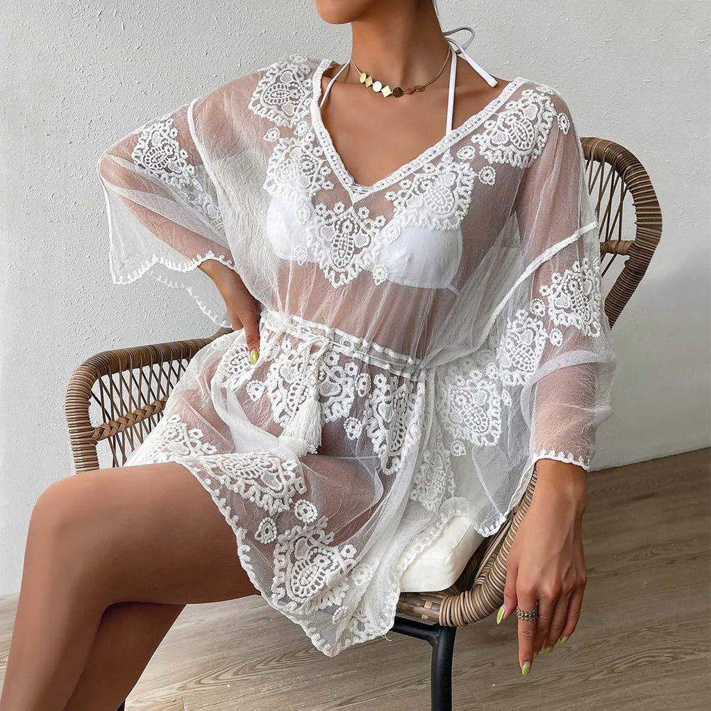 White beach blouse with a water soluble texture, shown as a free-size cover-up for swimming and sun protection.
