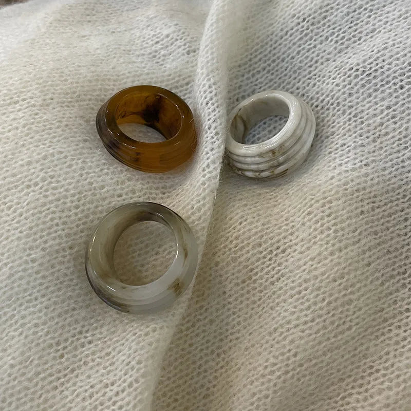 Geometric irregular resin wide ring in Maillard Brown, Smoky Brown, and Latte White colours