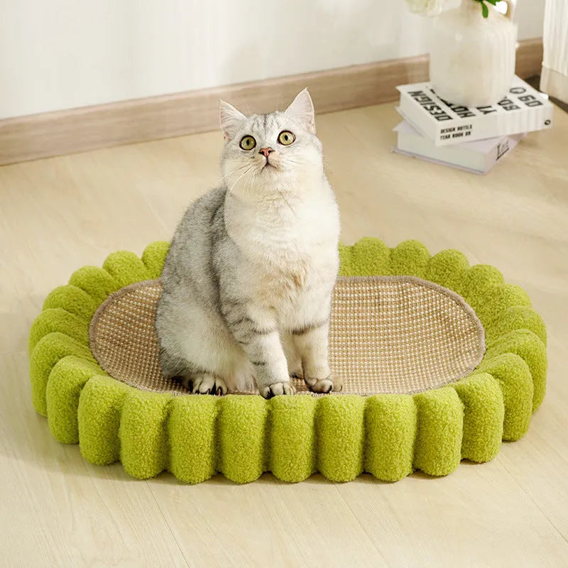 Green oval cat scratch pad and bed made from sisal measuring 650x420x100mm