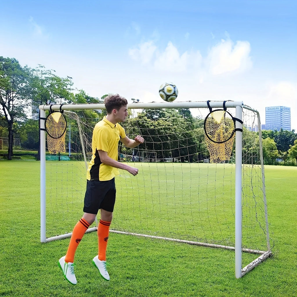 Portable soccer training goal net in black, used for practice shooting drills on grass
