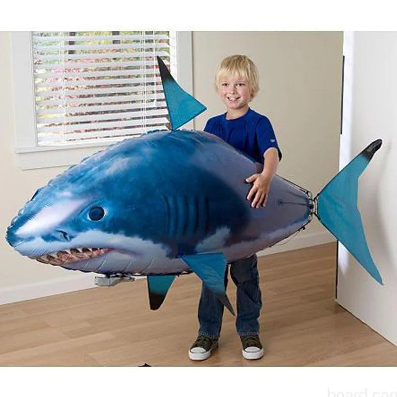 Large remote control shark inflatable balloon flying indoors with remote controller.