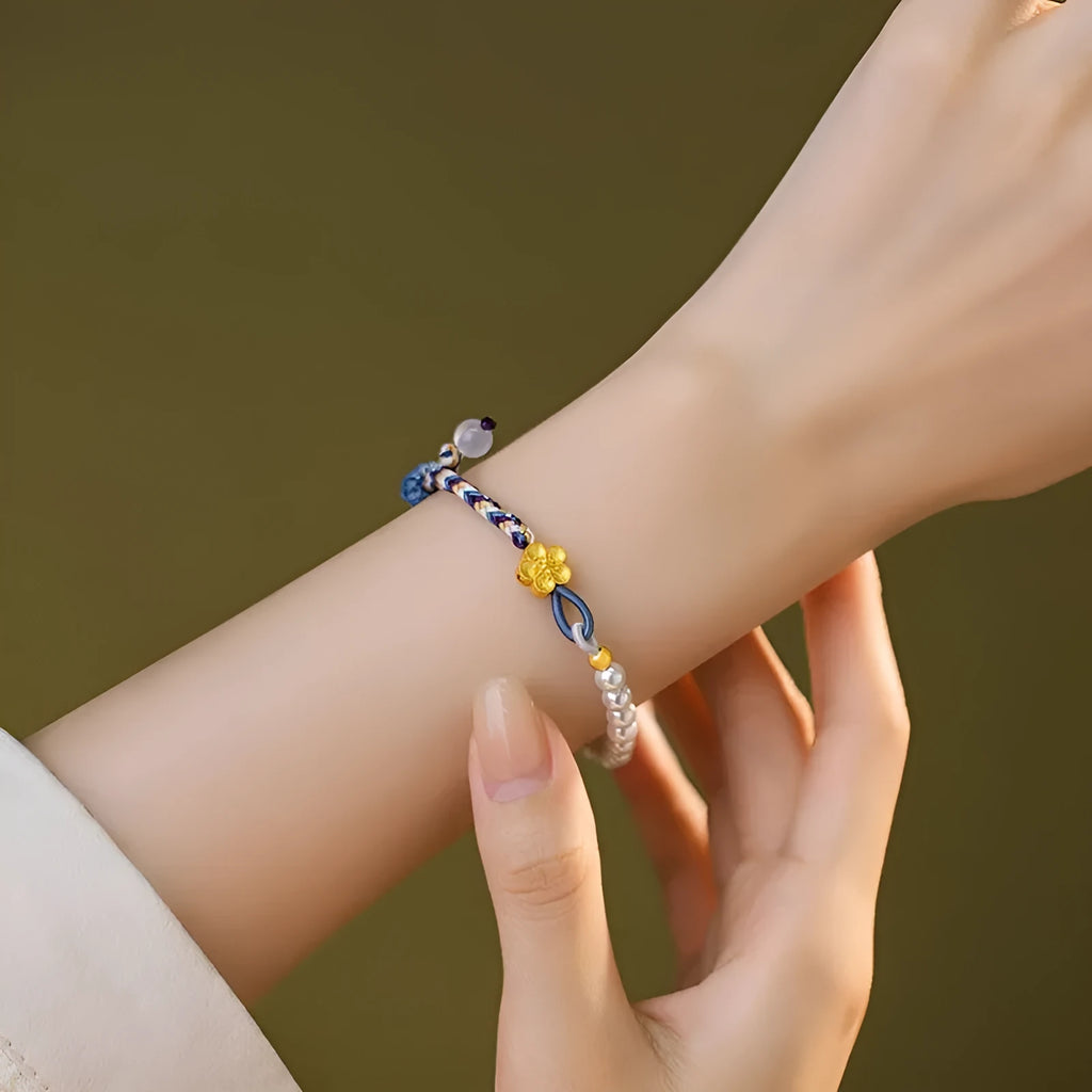 Colorful electroplated cord carrying strap with pearls and flowers and a sterling silver chalcedony charm