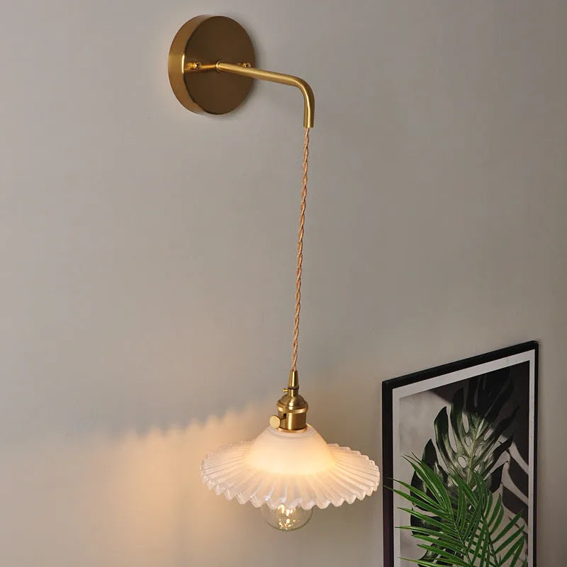 Copper retro brass lotus wall lamp with glass shade in choice of six colours on wall