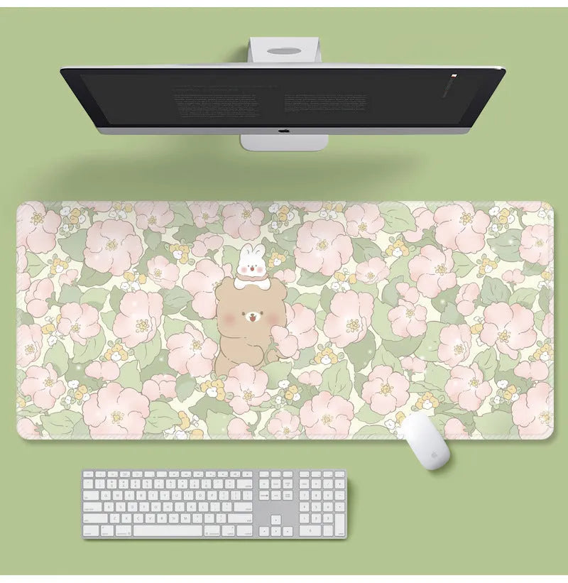 Large floral pattern mouse pad on a desk with keyboard and mouse