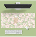 Large floral pattern mouse pad on a desk with keyboard and mouse