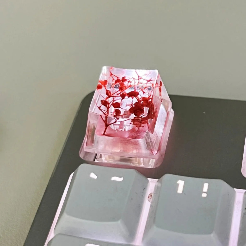 Transparent resin mechanical keyboard keycap showing starry sky galaxy design in multiple colour options