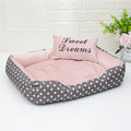Polka dot print small dog bed with matching square pillow in grey, blue, pink or red.